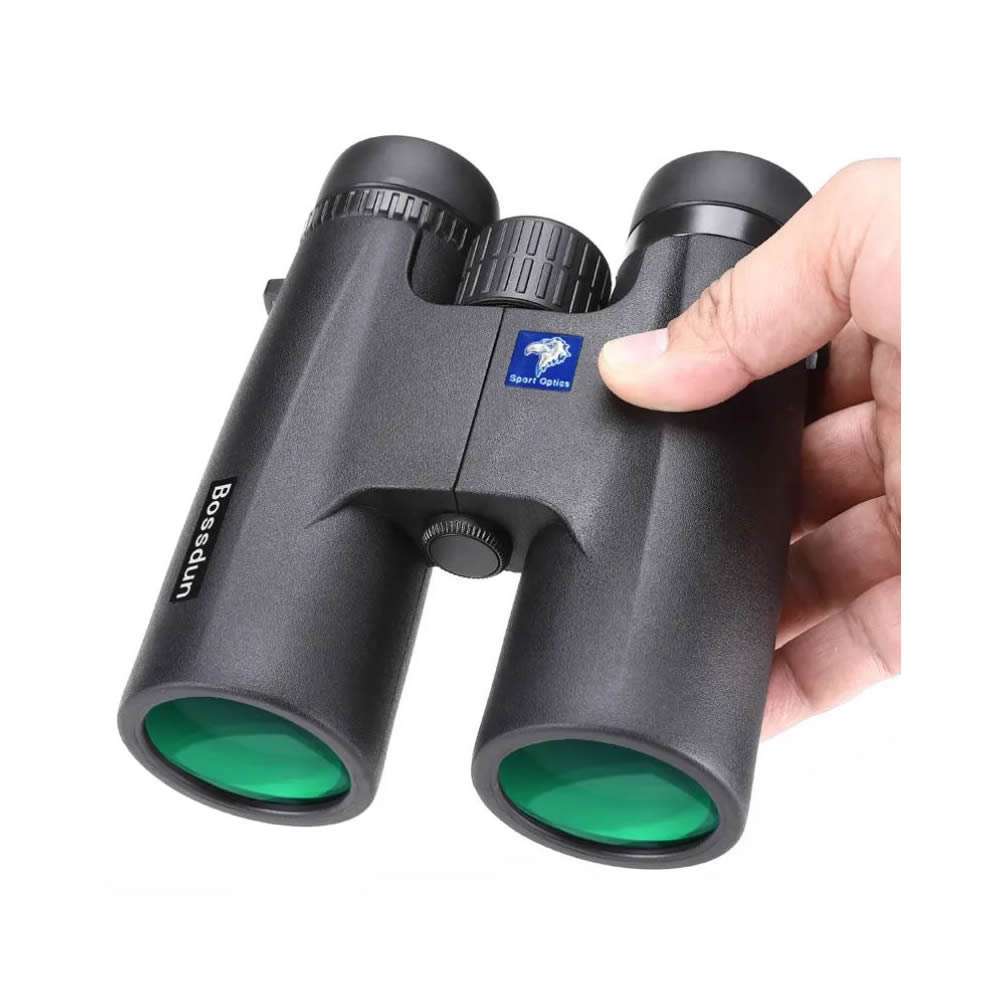 surveillance binoculars in the hand for size